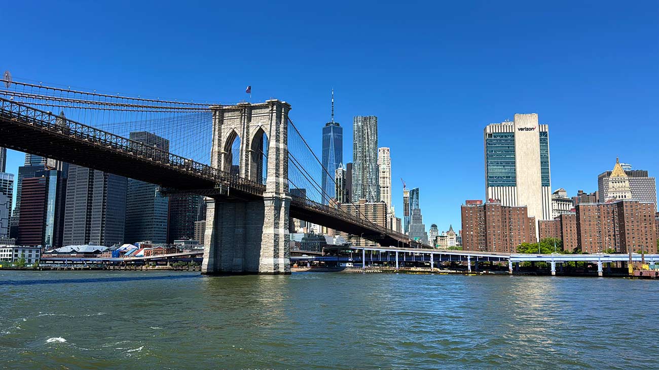 Brooklyn Bridge and Manhattan skyline seen from New York Harbor