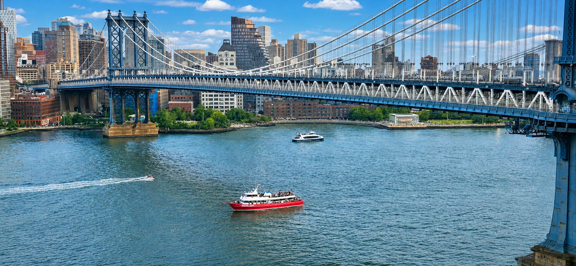 The Moonlight boat passes underneath the Manhattan Bridge.
